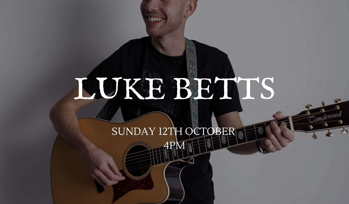 Luke Betts playing guitar