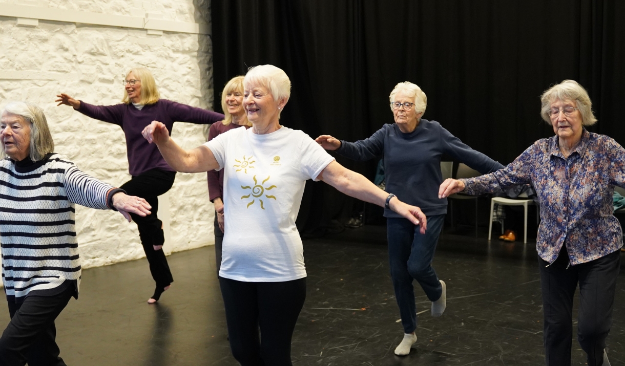 A group of ladies dancing in a studio