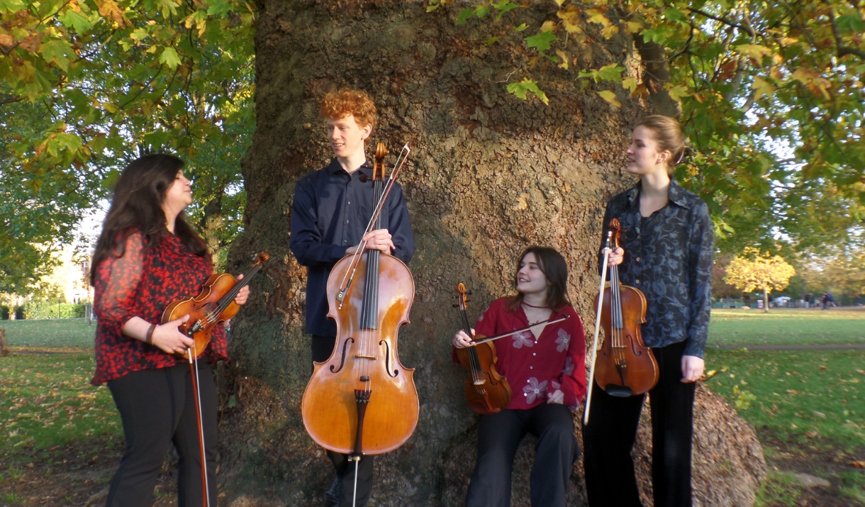 Nadejda String Quartet out in nature with their instruments