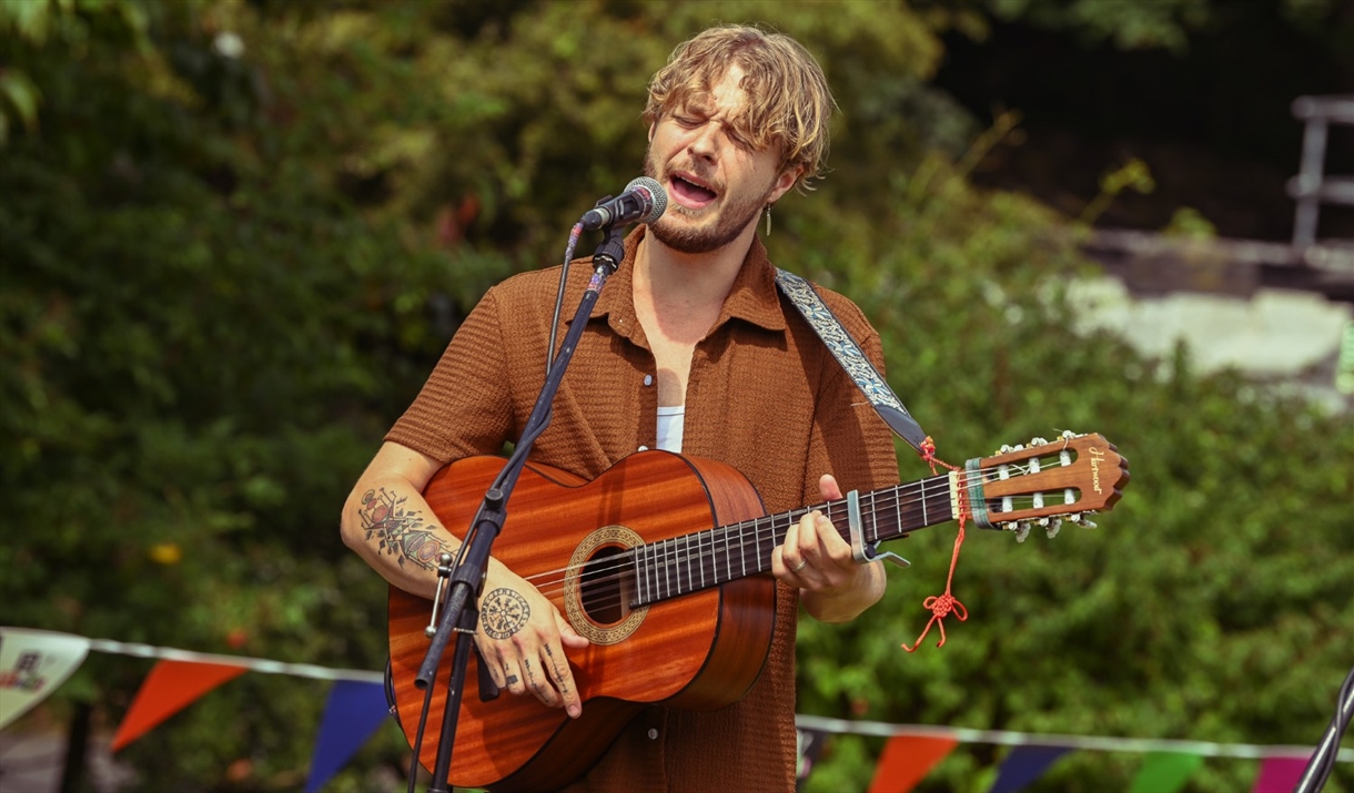 Performer singing at an event held by BarrowFull in Barrow-in-Furness, Cumbria