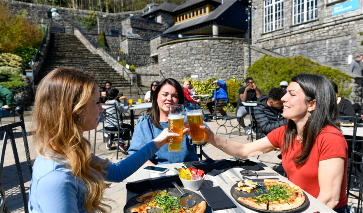 Visitors Enjoying Outdoor Dining at Brewery Arts Centre in Kendal, Cumbria