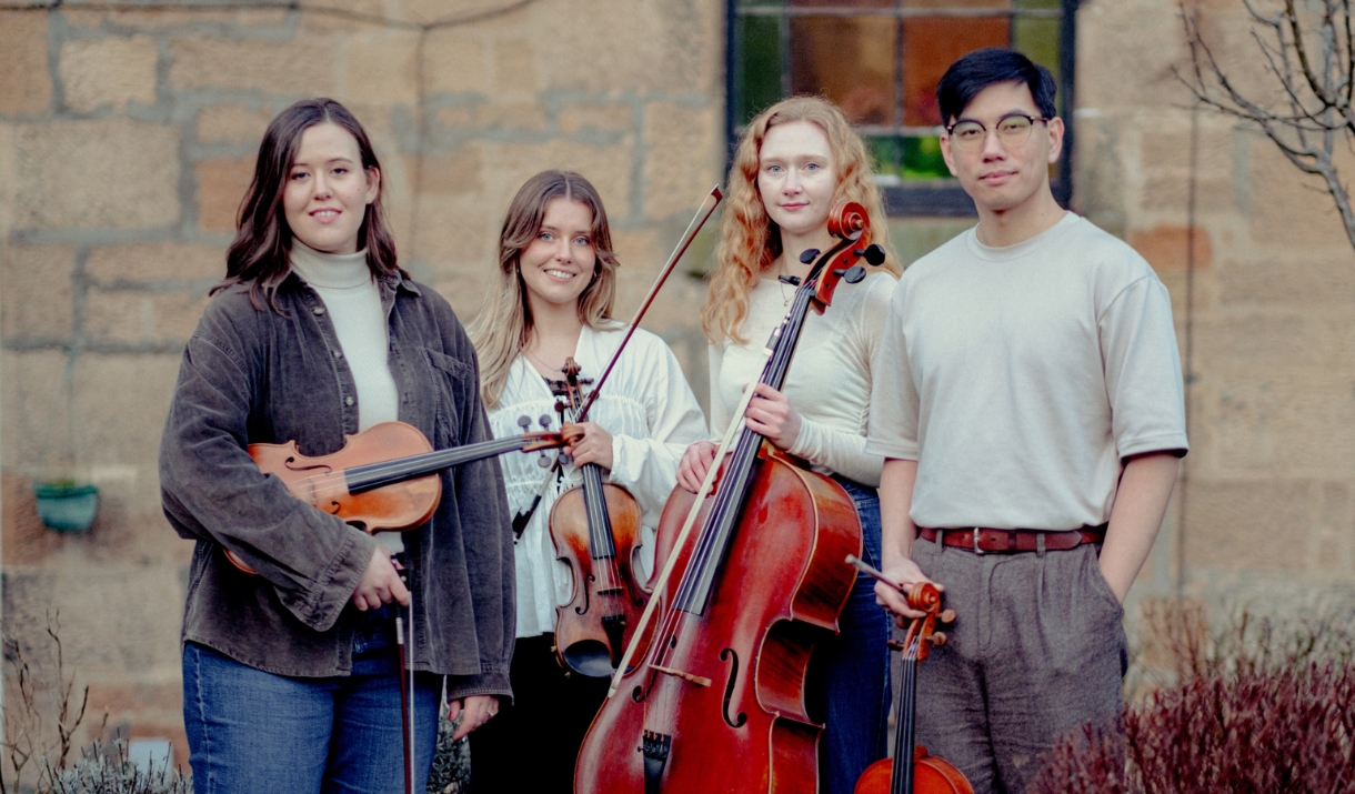 Resol String Quartet smiling with their instruments