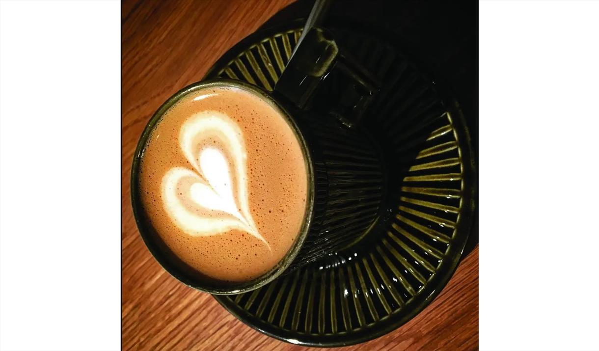 Latte with foam heart art from the Crafting the Perfect Coffee workshop at Rosehill Theatre in Whitehaven, Cumbria