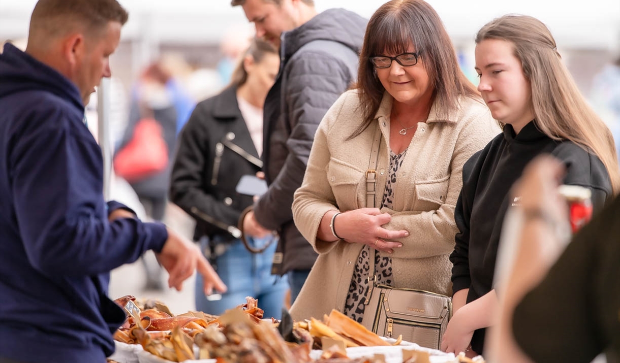 Shoppers browsing one of the stalls at the 2025 Taste Cumbria Wigton festival