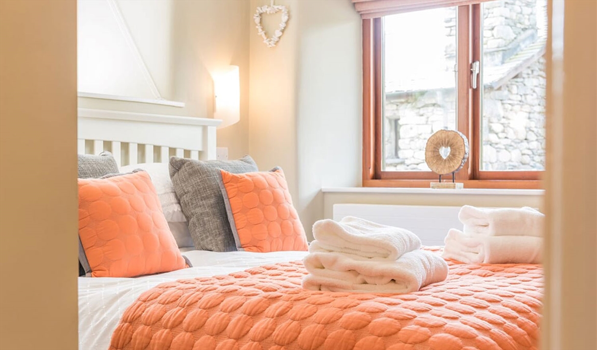 Double Bedroom and Folded Towels in The Byre at The Yan in Grasmere, Lake District