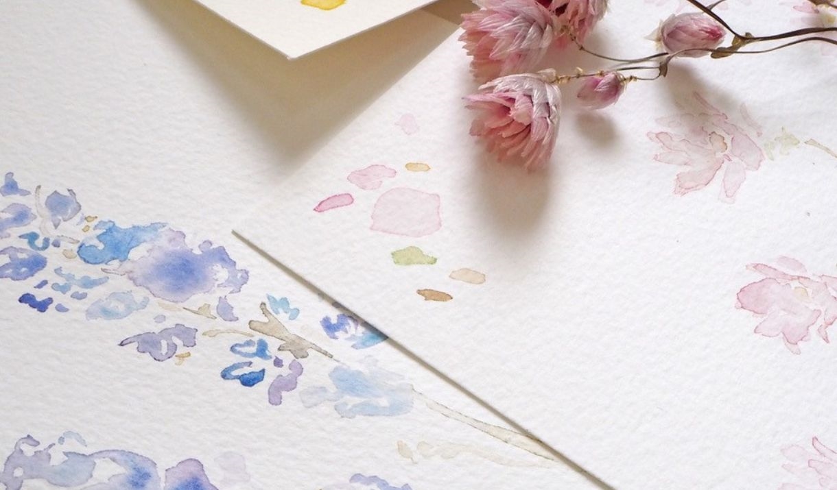 Botanical Watercolour work with a flower laid on top