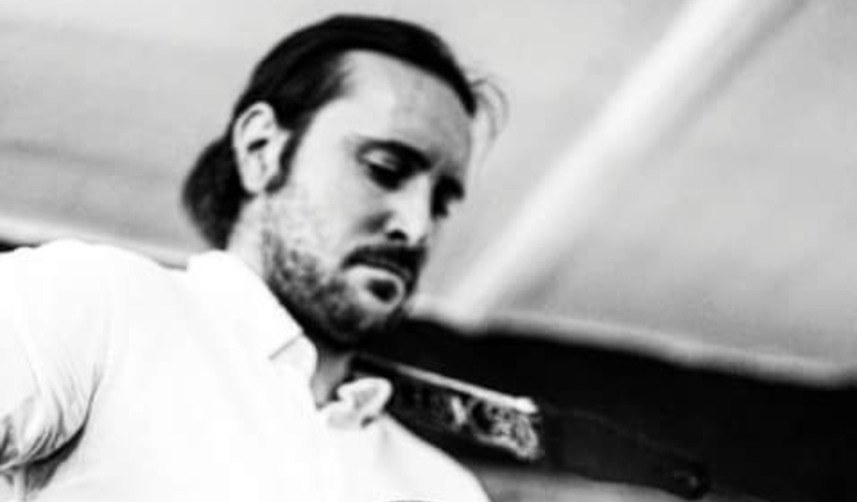 Person playing a guitar