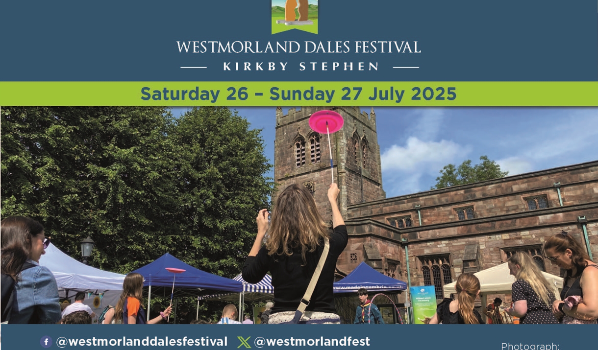 Poster for Westmorland Dales Festival in Kirkby Stephen.
Image of people at the festival by a church