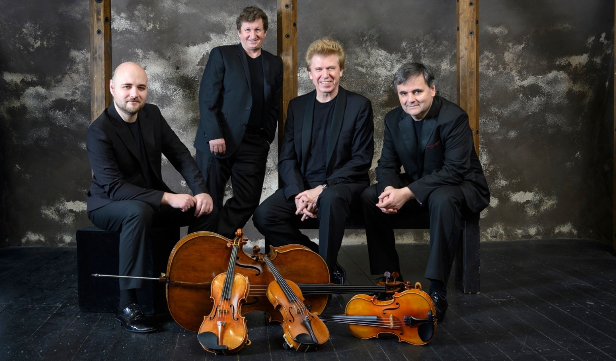 Wihan String Quartet sat with their instruments displayed in front of them