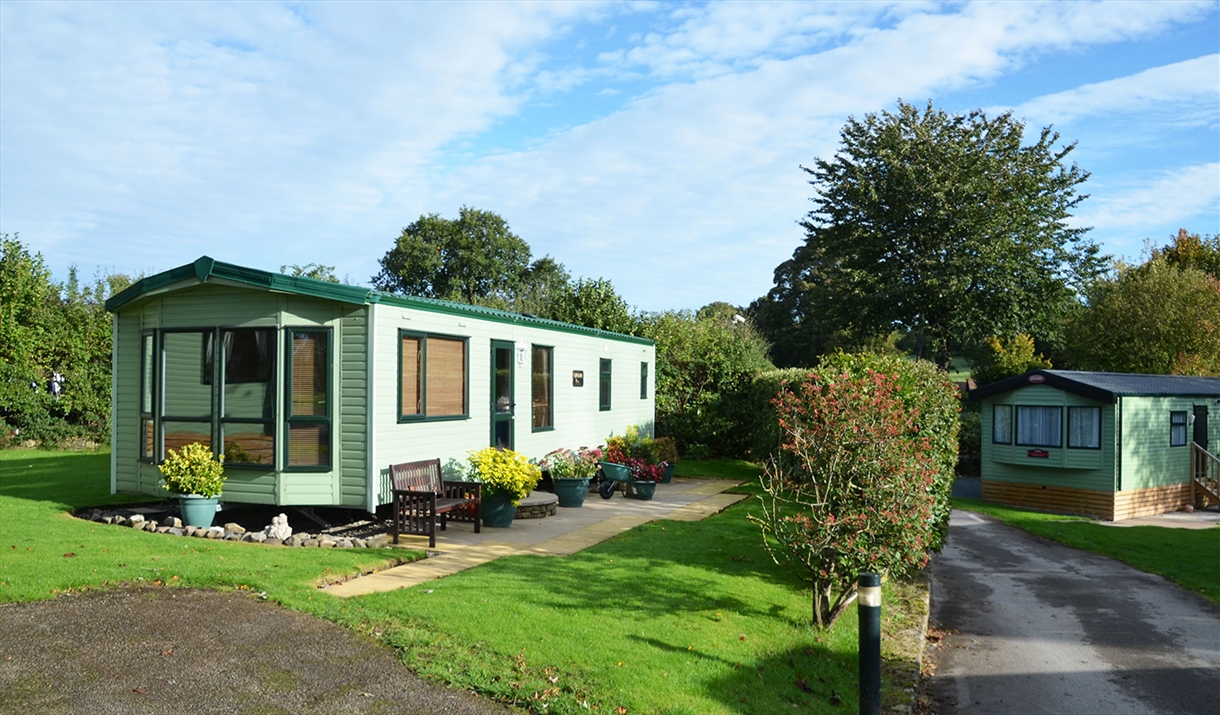 Caravan exteriors at Woodclose Caravan Park in Kirkby Lonsdale, Cumbria