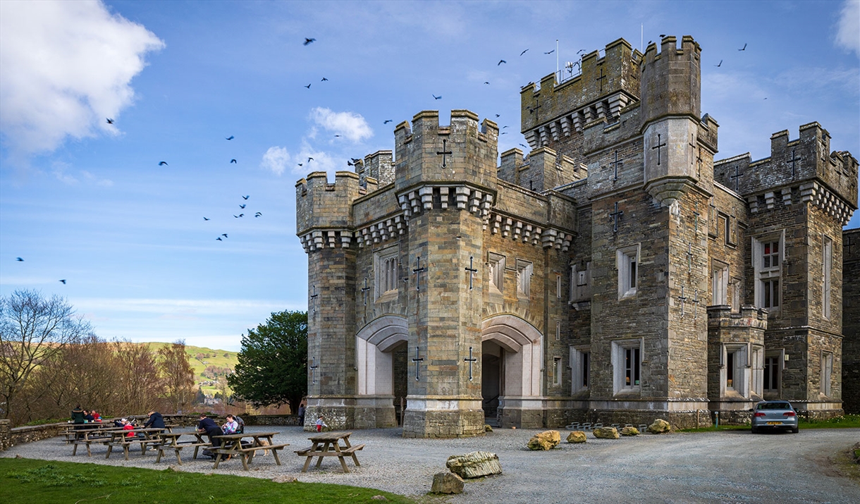 Exterior and picnic tables at Wray Castle, Low Wray, Ambleside, Lake District