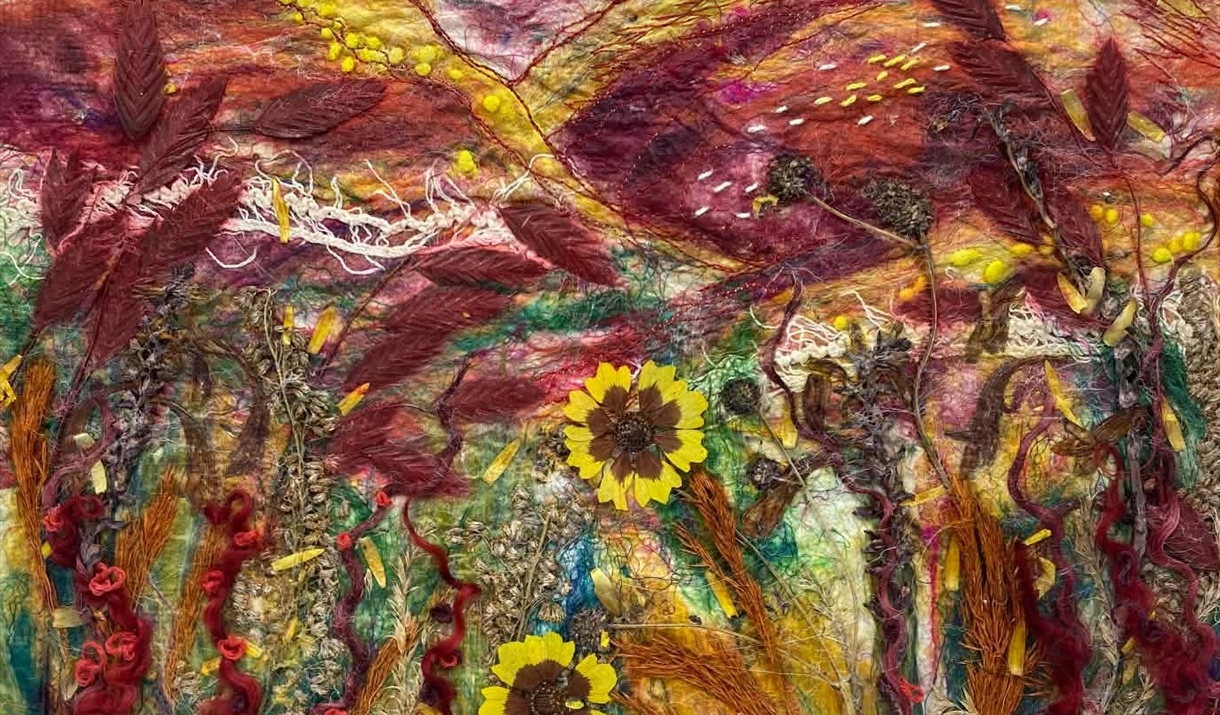 A colorful artwork featuring sunflowers surrounded by lush grasses in a serene field setting, capturing the essence of late summer.
