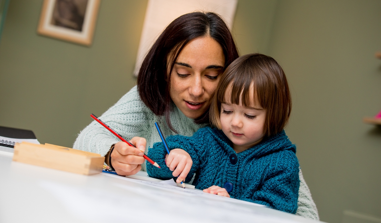 Mother and child drawing together