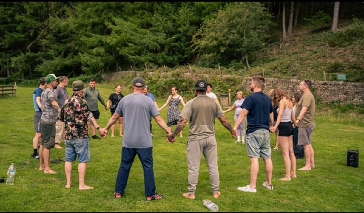Group of people holding hands in a circle