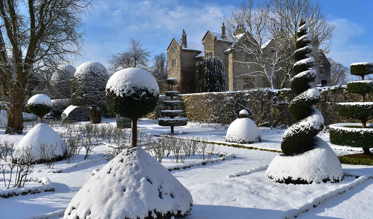 Snow topped topiary at Levens Hall near Kendal, Cumbria