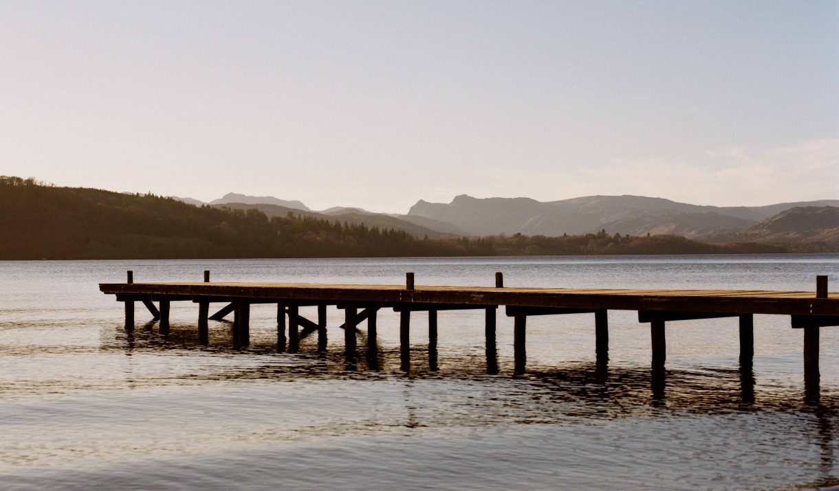 A photo by Juliet Klottrup of a wooden jetty outstretched over a lake in Cumbria