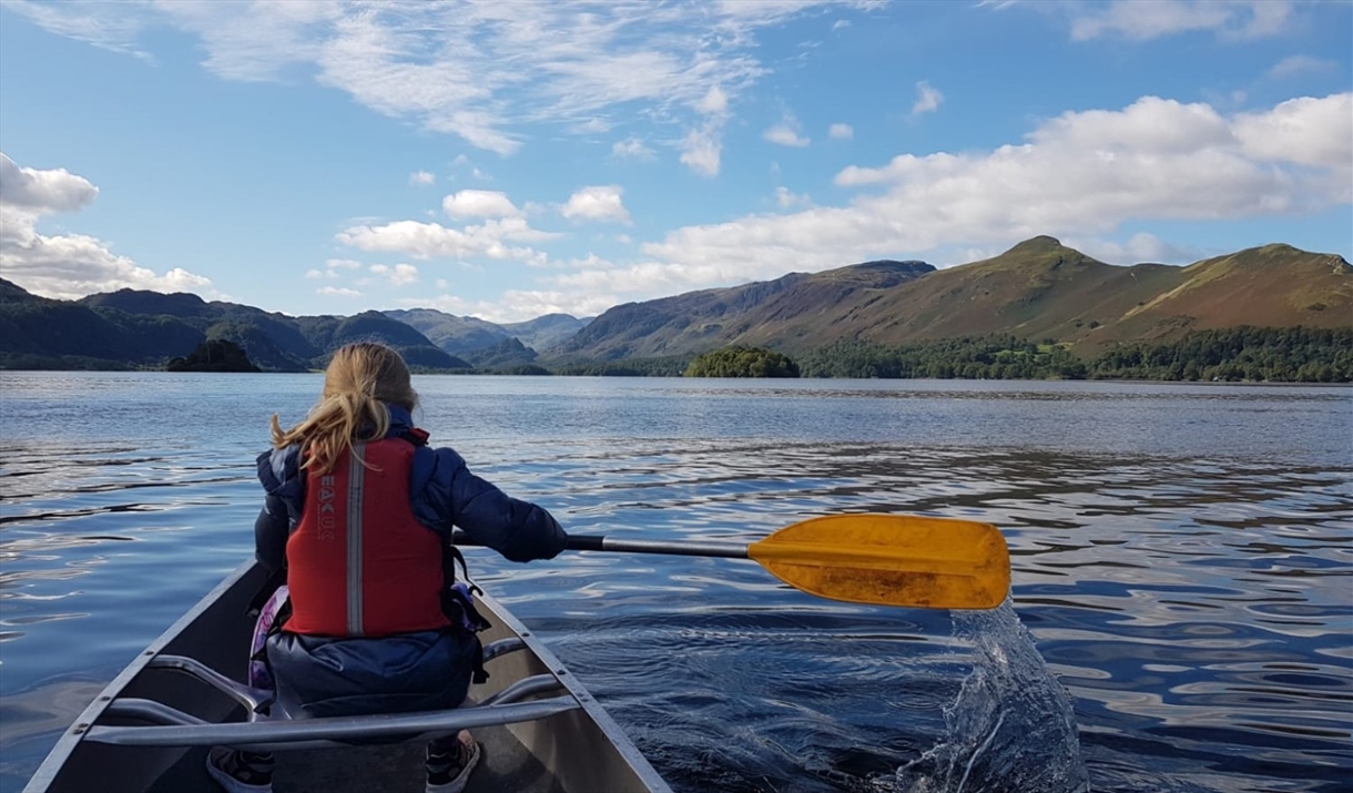 Visitor canoeing with Newlands Adventure Centre in the Lake District, Cumbria