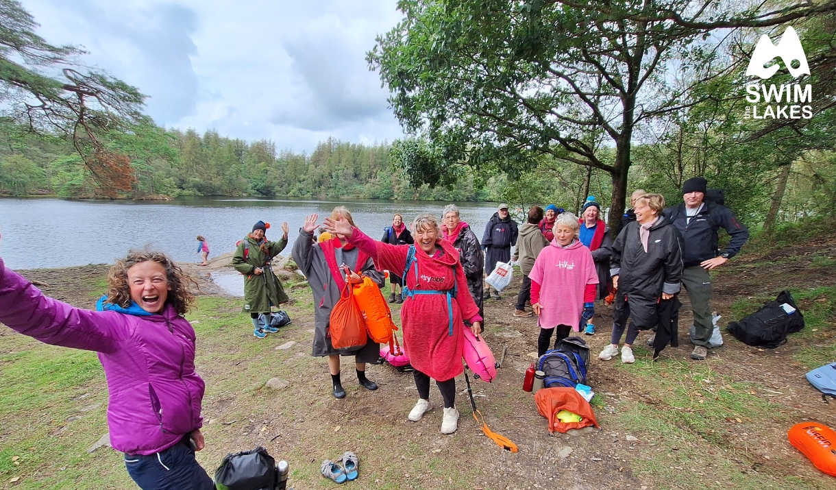 Waving Swimmers stood on the edge of a Lake District Tarn
