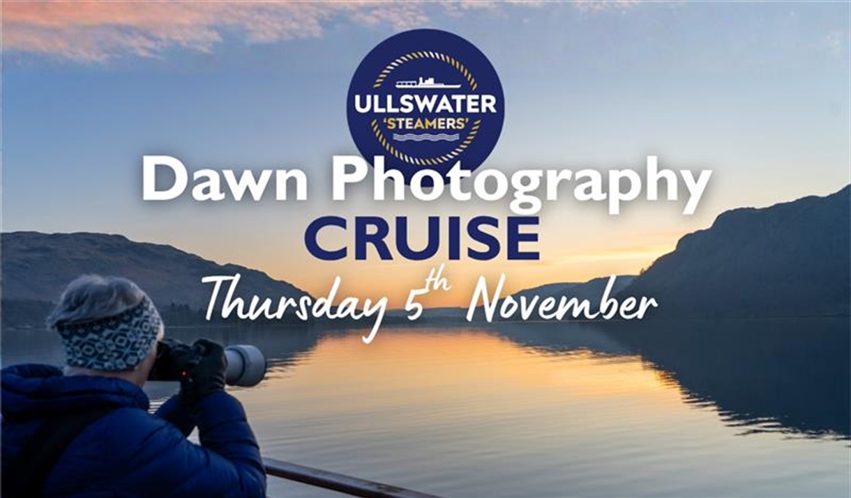 Dawn breaking over Ullswater with person taking photograph