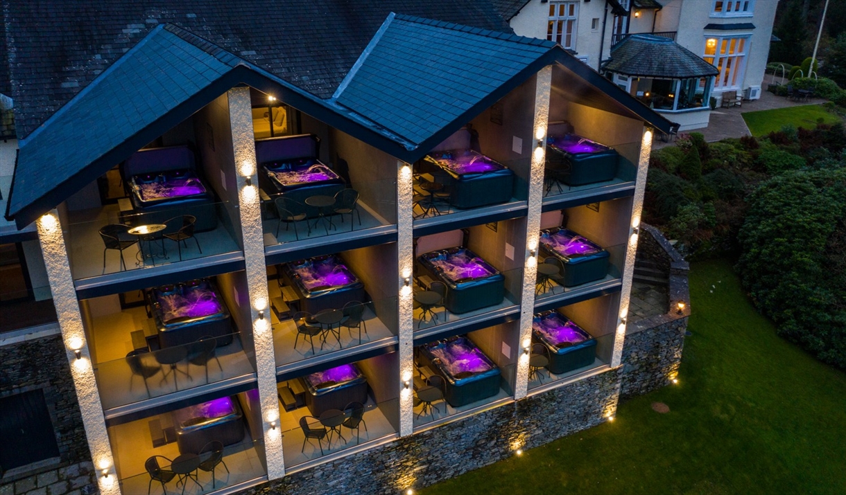 Drone photo of West Wing bedrooms and hot tubs at Lakes Hotel & Spa in Bowness-on-Windermere, Lake District