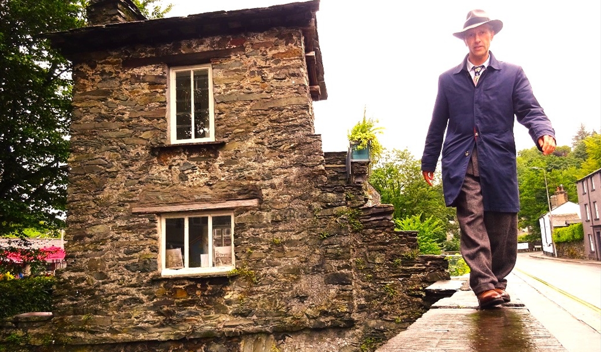 Anthony Padgett walking on the right-hand side of The Bridge House.