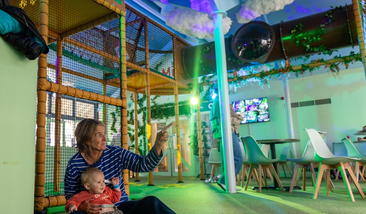 Family playing inside BeWILDerwood Lake District in Windermere