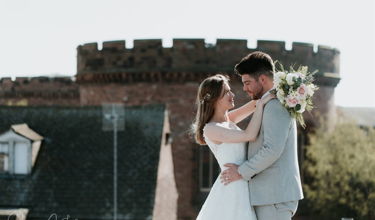 Bridal Couple posing for a photo near The Halston in Carlisle, Cumbria