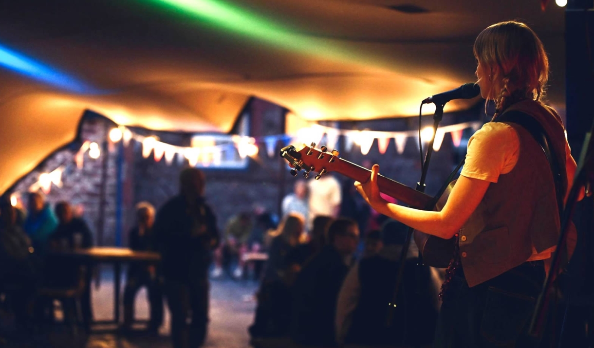 Grace Price performing at the soundwave sessions in The Stable Yard at Muncaster