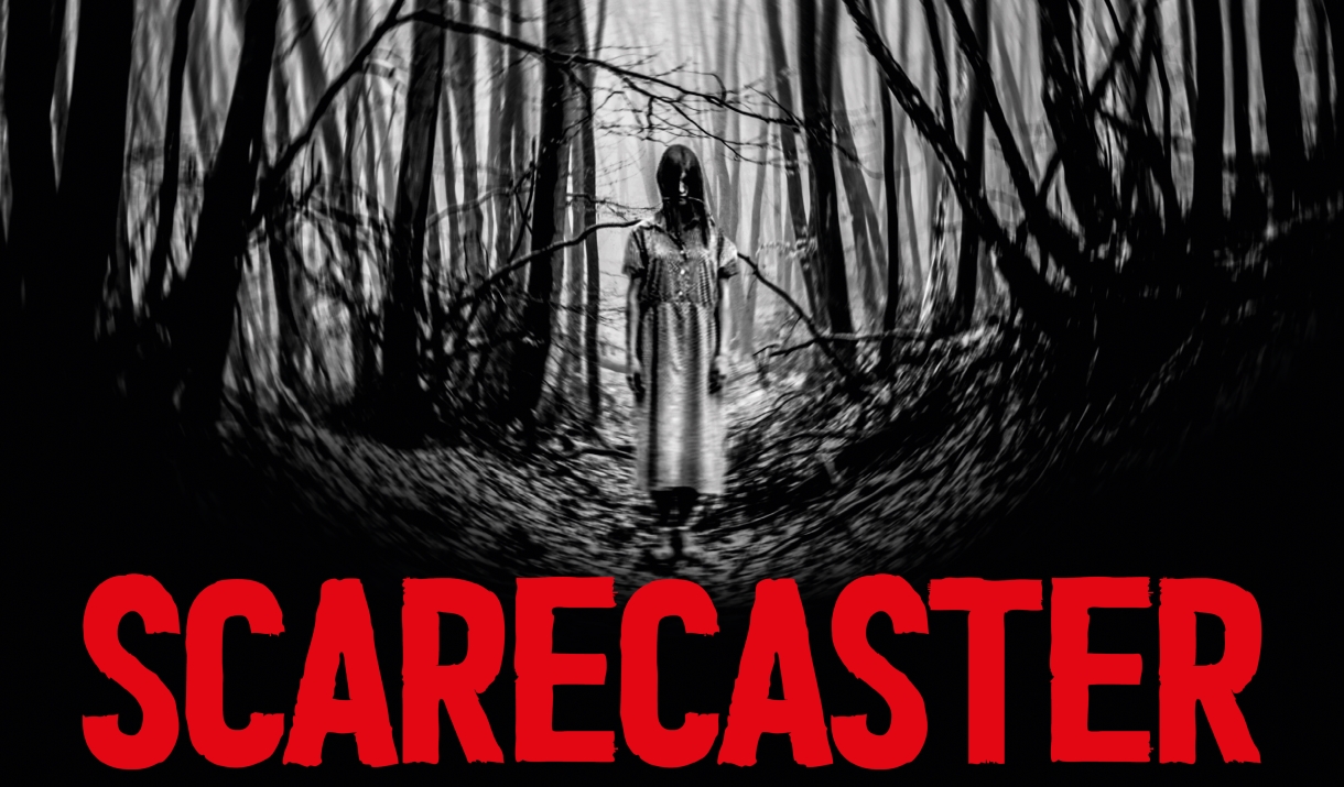 Gostly girl standing in forest with Muncaster Scarecaster Logo.