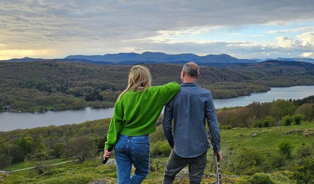 Socially Awkward stood overlooking a lake in Cumbria