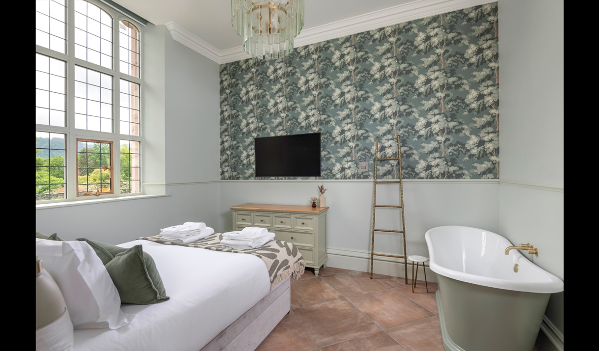 Main bedroom with bathtub at The Fernery at The Lingholm Estate in Portinscale, Lake District