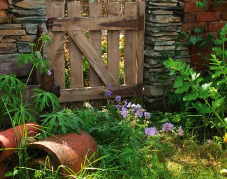 Garden plants and decor at The Peter Rabbit Garden at The World of Beatrix Potter in Bowness-on-Windermere, Lake District