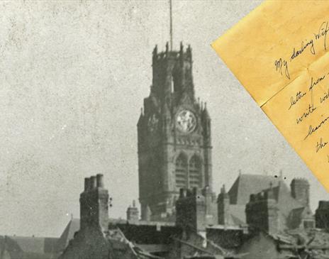 Black and white photo of a Church with a hand written letter sitting on on top of said photo