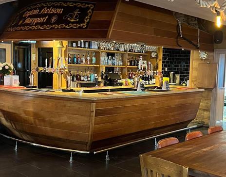 Nautical themed bar shaped like a ship's stern at Captain Nelson Tavern in Maryport, Cumbria