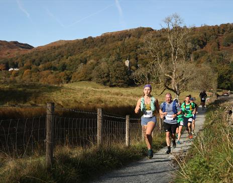 People running through the lake district