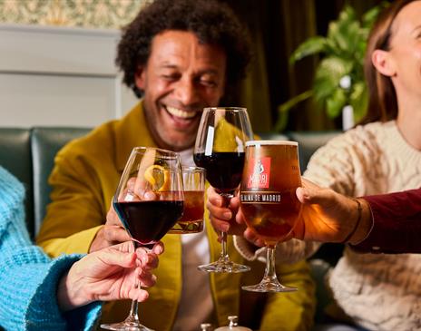 Guests enjoying drinks at The Ambleside Inn in Ambleside, Lake District