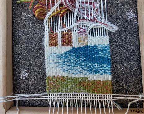 Tapestry being worked on at a workshop at Farfield Mill in Sedbergh, Cumbria