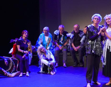 A group of ladies performing on stage