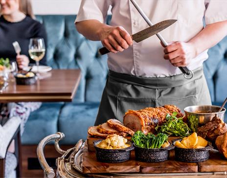 Chef Carving in the Restaurant at The Borrowdale Hotel in Borrowdale, Lake District