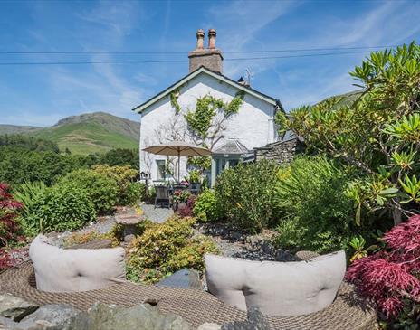 Outdoor seating and garden at Broadrayne Farm Cottages in Grasmere, Lake District