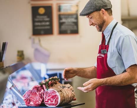 Butcher working at Cranstons in Cumbria