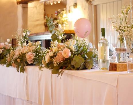Head Table Decorations for a Wedding at Crooklands Hotel in Milnthorpe, Cumbria