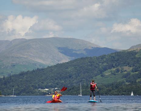 Visitors Kayaking and Paddleboarding at Windermere Canoe Kayak in the Lake District, Cumbria