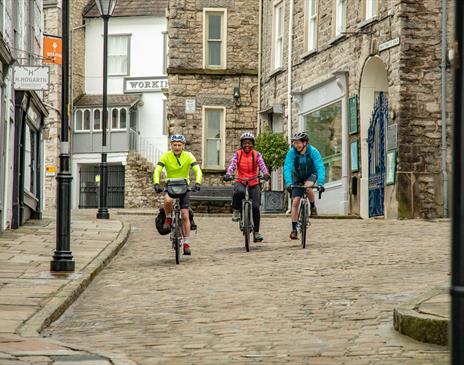 Visitors Cycling in Kendal with E-Bike Safaris Ltd in the Lake District, Cumbria