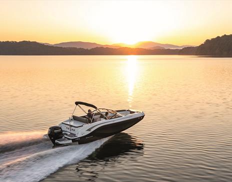 Boat on a Lake at Sunset, from Freedom Boat Club Windermere in Bowness-on-Windermere, Lake District