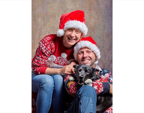 Couple and Dog at the Santa Paws Festive Photo Studio at Fell Foot, Lake District