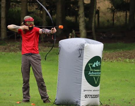 Visitor Playing Archery Tag with Genuine Adventures in the Lake District, Cumbria