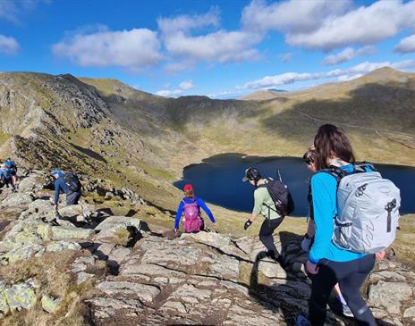 Visitors Walking Helvellyn via Striding & Swirral Edge with Guided Outdoors in the Lake District, Cumbria