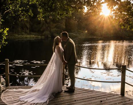 Bridal Couple Posing at Sunset at a Wedding at The Gilpin Hotel & Lake House in Windermere, Lake District