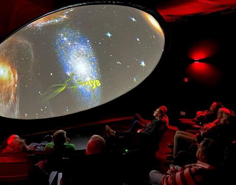 Visitors watching a display at the Grizedale Observatory in the Lake District, Cumbria